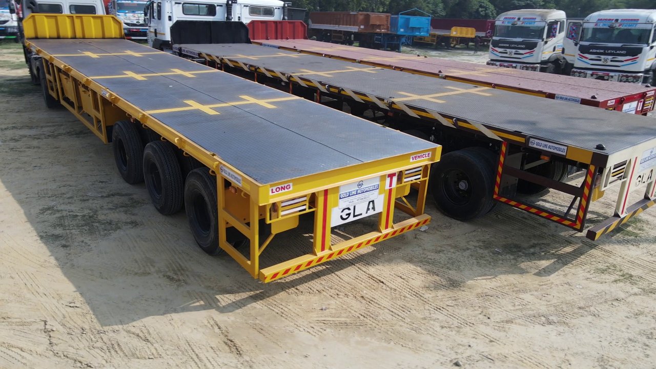 GoldLine Yellow Flatbed Trailer close-up with GLA branding