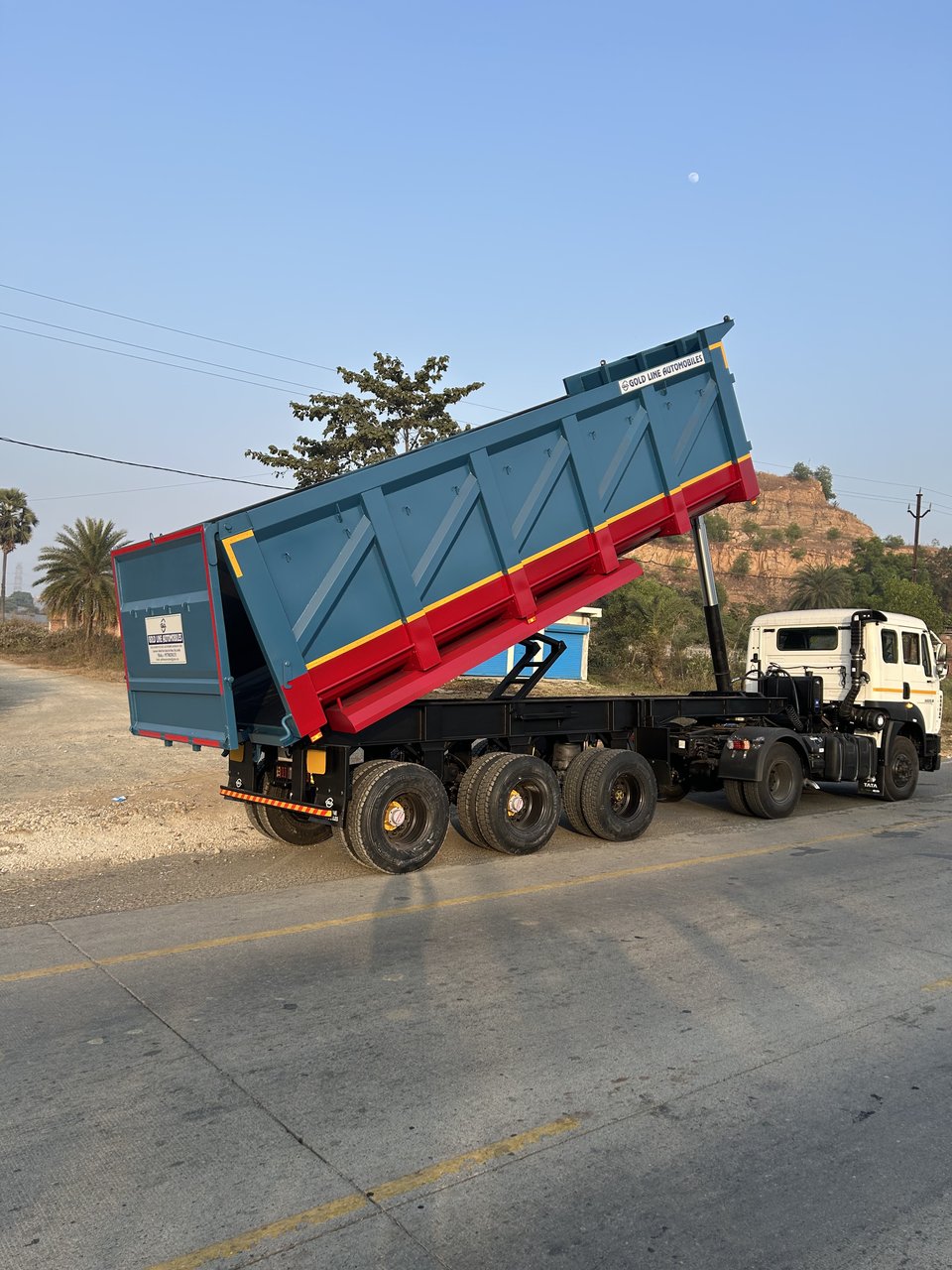 GoldLine Tip Trailer body raised on road